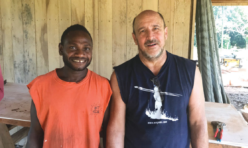 Cleon Watts, right, made new friends when he went from Community Baptist Church to Papua New Guinea to help build a house for Seth and Kaitlyn Sanford Cleon Watts, right, made new friends when he went from Community Baptist Church to Papua New Guinea to help build a house for Seth and Kaitlyn Sanford
