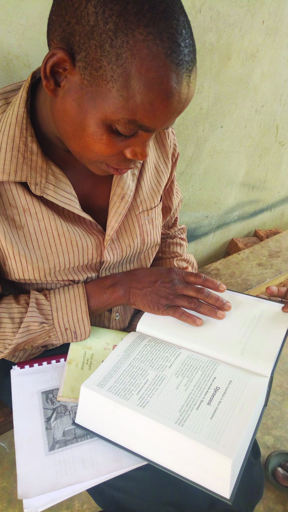 Lolo believer with Bible